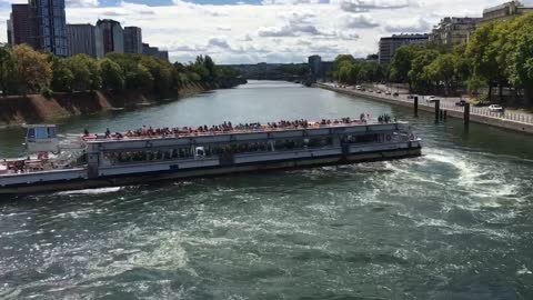 A cruise ship turning on the Seine