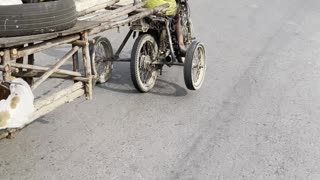 Motorcycle With Many Wheels Cruises Along Street