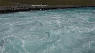 New Zealand, Lake Pukaki, canal gate-power of water - nature used by industry.