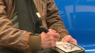 Old man brown jacket sketching woman