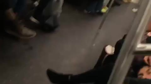 Girl plucks her boyfriend's eyebrows on a subway train
