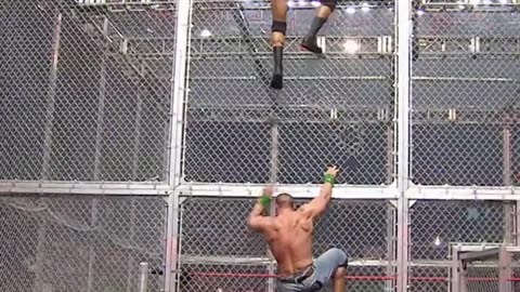 Randy Orton & John Cena brawl on top of HIAC