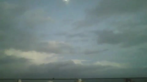 The moon, sky, boats and sea, being filmed at nightfall, in a beautiful view [Nature & Animals]