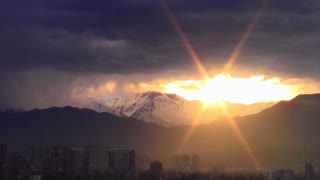 Snow falling at mount Andes during sunrise in Santiago, Chile