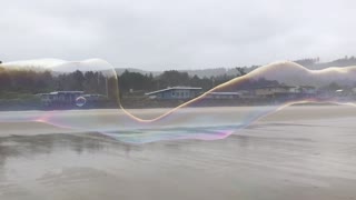 Incredible Giant Bubble Stretches Along Beach