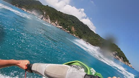 Two jet ski riding mediterranean sea