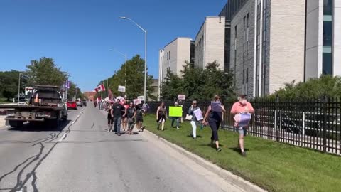 Western University students march in opposition to the Vax Booster Mandate