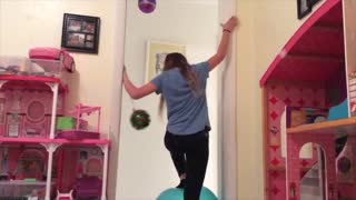 Girl Tries Balancing On Exercise Ball and Falls