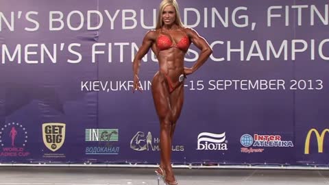 Fitness competitor, Suzy Toldi, posing