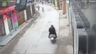 Lady on Moped Drops her Baby Near Oncoming Truck