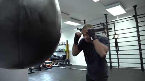 Man Punching a Punching Bag