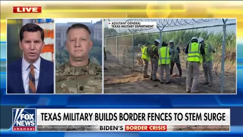 Texas military builds fence at Del Rio in response to a reported surge of migrants to come.