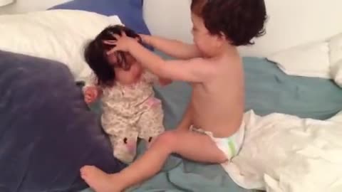 Toddler Lovingly 'Washes' Baby Sister's Hair