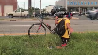 Man Rides His Bike the Hard Way