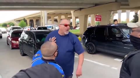"You're an a**hole," Man freaks out on officer as protest blocks traffic