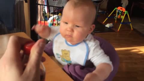 Baby tries Cola for the first time