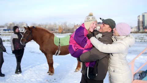 Hippotherapy for kid with cerebral palsy syndrome at winter
