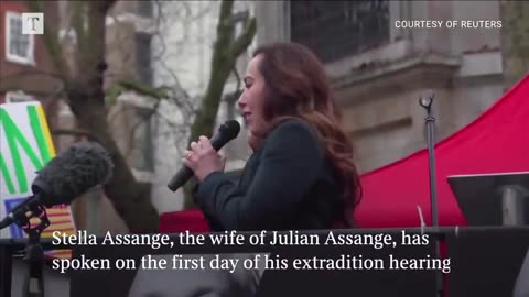 Wife of Julian Assange protests on the first day of extradition hearing