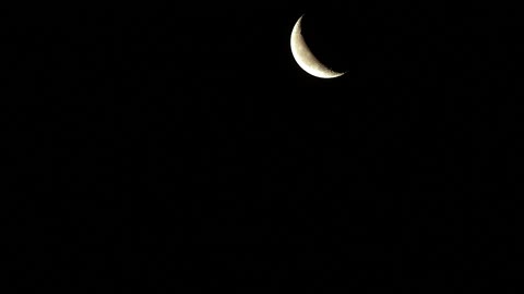 Moon moving in the night sky