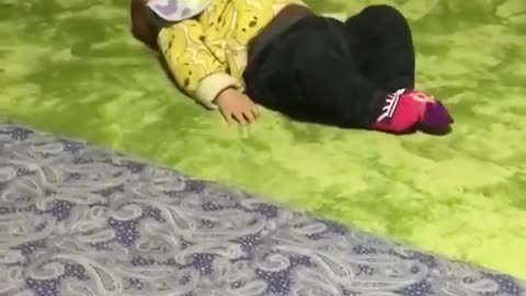 A child performing difficult acrobatic movements on the bed