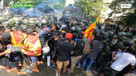 Police shoot at crowd as protesters storm PM Office in Colombo