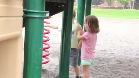 I little kid first make Kiss to his little friend on the ground