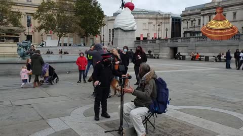POLICE HARASSING A STREET ENTERTAINER FOR NOT WEARING A MASK WHILE PLAYING THE FLUTE