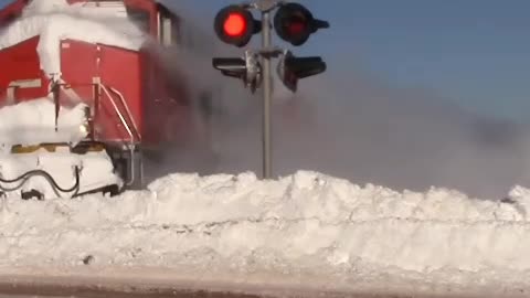 Train speeds through deep snow
