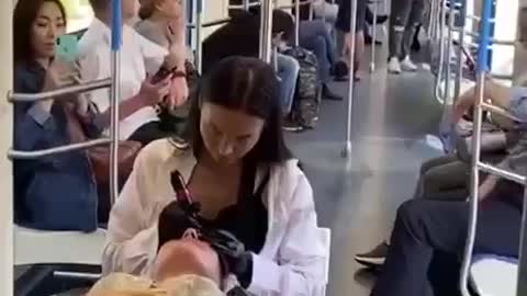 In one of the subway cars, girls were noticed doing eyebrow tattooing.