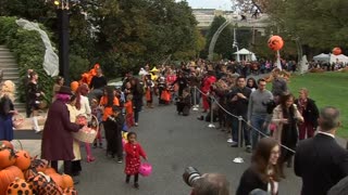 The Obamas welcome trick-or-treaters to the White House