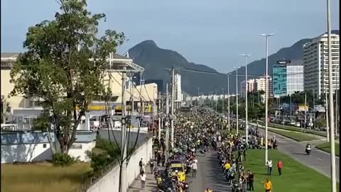 Without a mask, President Jair Bolsonaro takes part in a motorcycle tour in Rio de Janeiro