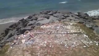 Walking towards the rocks of the beach, and showing the sea on a sunny day [Nature & Animals]