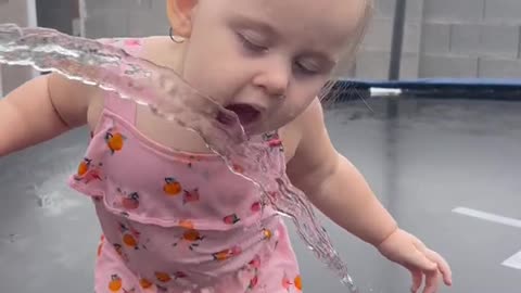 little girl drinking water