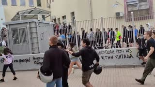 A large group of antifa protesters gathered outside a school in Thessaloniki, Greece