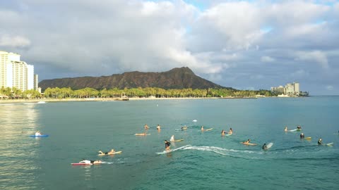 video drone tracking a surfer riding the wave