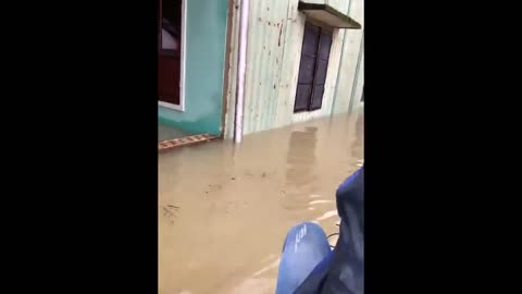 Floods in Vietnam force locals to navigate through submerged streets on rafts