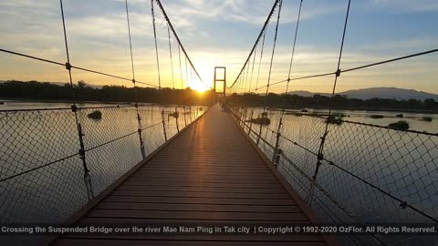 Crossing the Suspended Bridge over the river Mae Nam Ping in Tak city