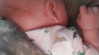 Dad and baby in bedroom nap time turns into breastfeeding attempt