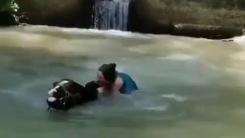 Girl fall in the lake with her horse while crossing