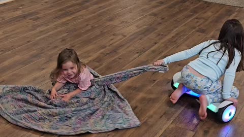 Sisters Take Hoverboard For a Spin