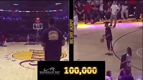 Fan hits half court shot and wins $100,000