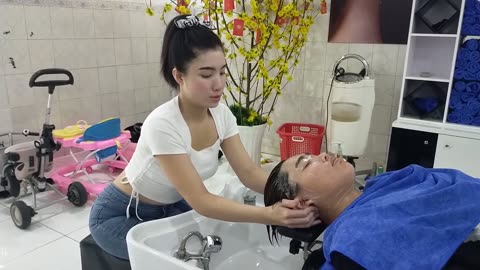 Relaxing shampoo and facial massage at Vietnamese barbershop after a series of stressful working day