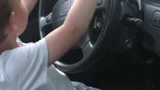 Kid Enjoys Driver's Seat