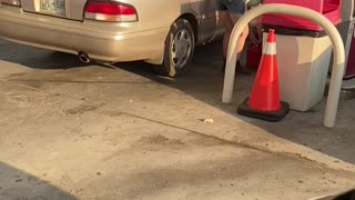 Woman Has Inefficient Way to Get Gas