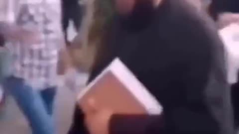 Protesters in Iran knocking off turbans from the head of Islamic scholars in Iran