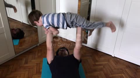 Father And Child Exercising At Home Stock Video - Download Video Clip Now - iStock