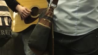 Group of men playing instruments on subway train