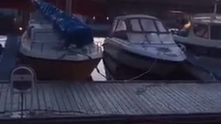 Guy jumping into boat