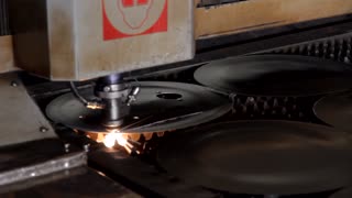 working process of metal cutting in a workshop