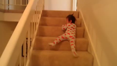 13 months old baby sliding down stairs